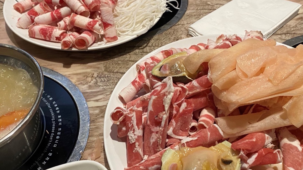 Sichuan hotpot with sliced meat and vegetables