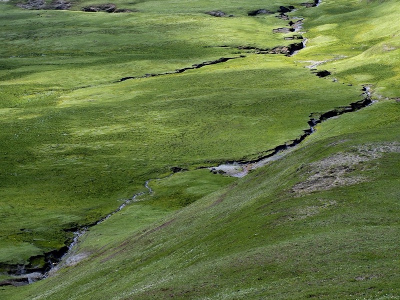 Green grasslands and hills in Tagong, western Sichuan